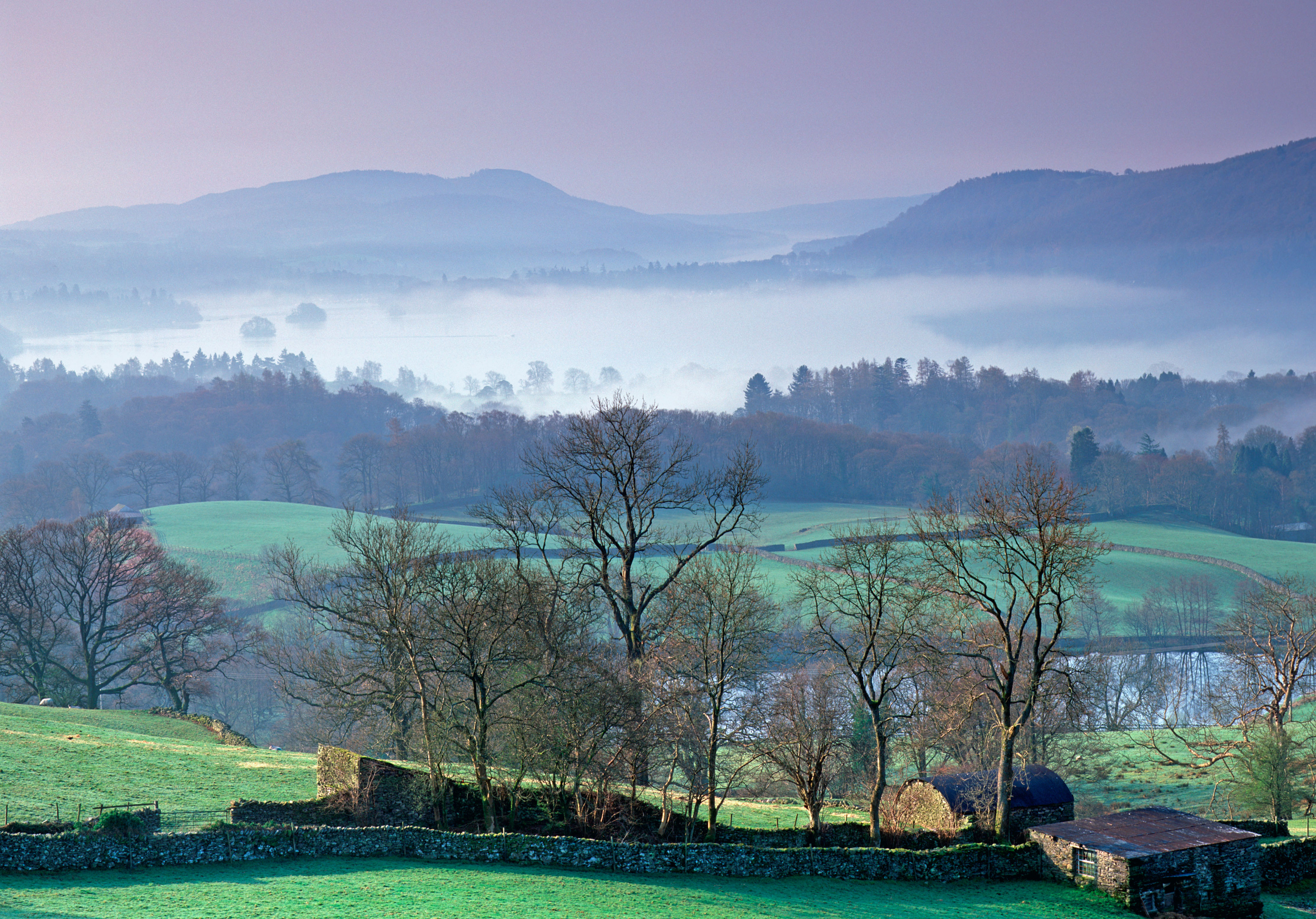 Looking South over Lake Windermere from Troutbeck. The lake is covered in mist caused by a temperature inversion common in Spring and Autumn.