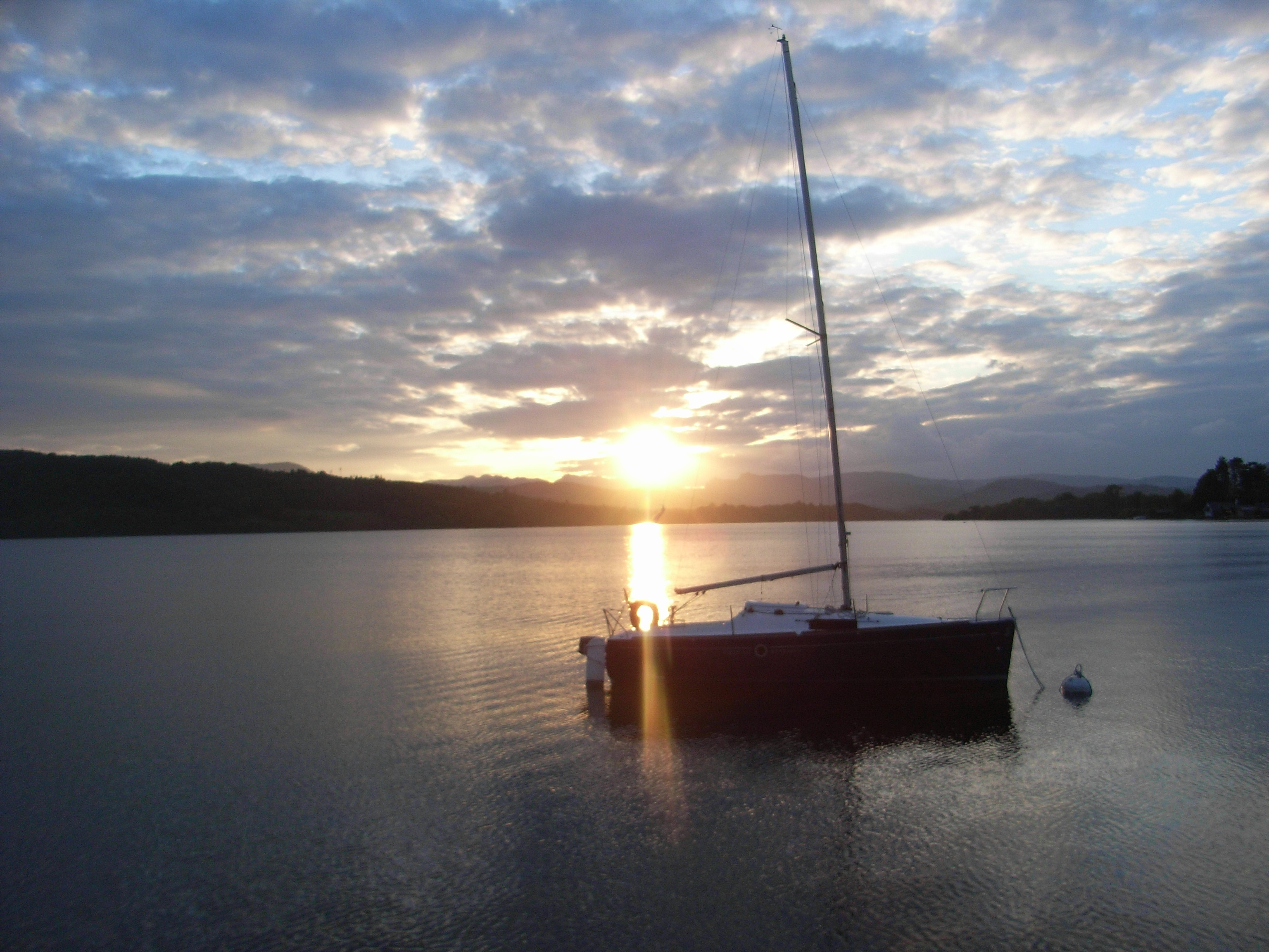 A yacht in the calm waters of Lake Windermere