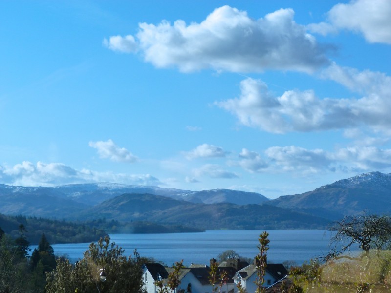 The view from our porch today. The sky was so blue, which was reflected in the waters of Windermere and thence to the mountains.